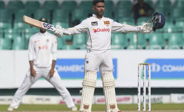 Sri Lanka's Pathum Nissanka celebrates his century during the second day of the second cricket test match between Sri Lanka and Bangladesh in Colombo, Sri Lanka, Thursday, June 26, 2025. (AP Photo/Eranga Jayawardena)