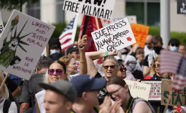 Protesters gather outside the Federal Courthouse before arguments about whether Kilmar Abrego Garcia can be released from jail on Friday, June 13, 2025 in Nashville, Tenn. (AP Photo/George Walker IV)