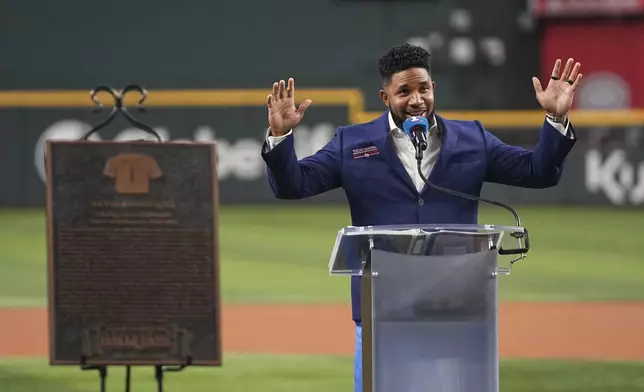 Former Texas Rangers player Elvis Andrus acknowledges cheers as he makes comments during a ceremony where Andrus was inducted into the clubs hall of fame before a baseball game against the Seattle Mariners Saturday, June 28, 2025, in Arlington, Texas. (AP Photo/Tony Gutierrez)