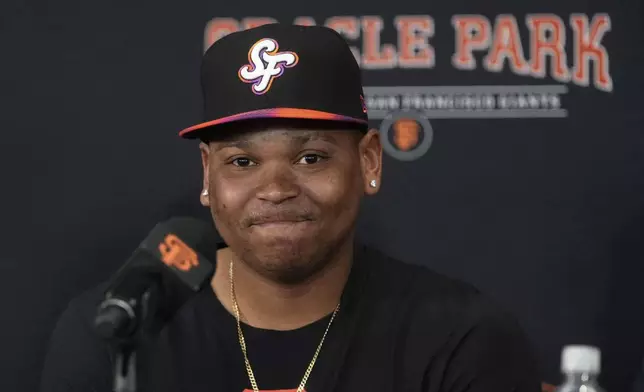 San Francisco Giants' Rafael Devers speaks at a news conference before a baseball game against the Cleveland Guardians in San Francisco, Tuesday, June 17, 2025. (AP Photo/Jeff Chiu)