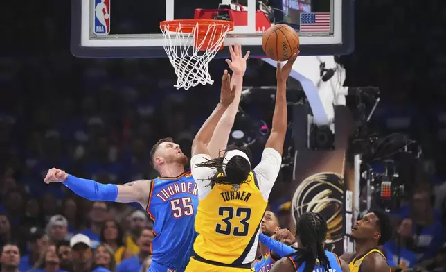 Indiana Pacers center Myles Turner (33) shoots against Oklahoma City Thunder center Isaiah Hartenstein (55) during the first half of Game 2 of the NBA Finals basketball series Sunday, June 8, 2025, in Oklahoma City. (AP Photo/Julio Cortez)