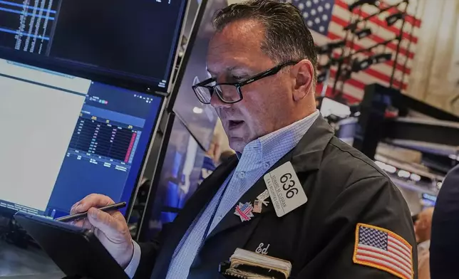 Trader Edward Curran works on the floor of the New York Stock Exchange, Monday, June 23, 2025. (AP Photo/Richard Drew)