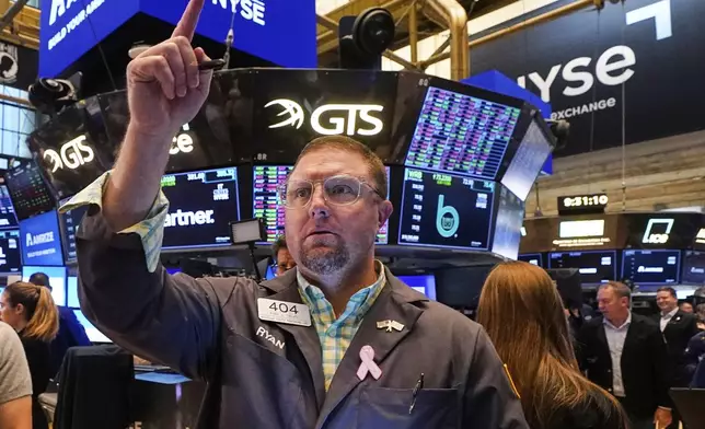 Trader Ryan Falvey works on the floor of the New York Stock Exchange, Monday, June 23, 2025. (AP Photo/Richard Drew)