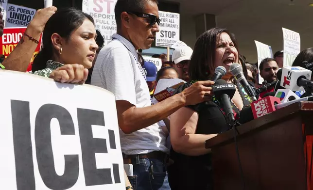 Angelica Salas, of The Coalition for Humane Immigrant Rights, speaks outside the Federal Building after federal immigration authorities conducted an operation on Friday, June 6, 2025, in Los Angeles. (AP Photo/Damian Dovarganes)