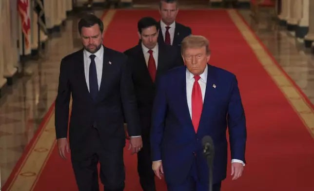 President Donald Trump arrives with Vice President JD Vance, Secretary of State Marco Rubio and Defense Secretary Pete Hegseth to speak from the East Room of the White House in Washington, Saturday, June 21, 2025, after the U.S. military struck three Iranian nuclear and military sites, directly joining Israel's effort to decapitate the country's nuclear program. (Carlos Barria/Pool via AP)