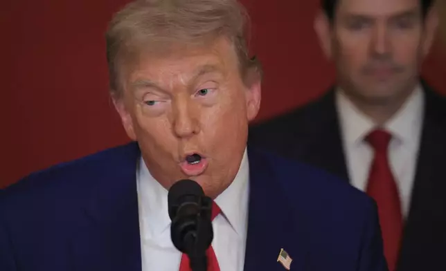 President Donald Trump speaks from the East Room of the White House in Washington, Saturday, June 21, 2025, after the U.S. military struck three Iranian nuclear and military sites, directly joining Israel's effort to decapitate the country's nuclear program, as Secretary of State Marco Rubio listens. (Carlos Barria/Pool via AP)