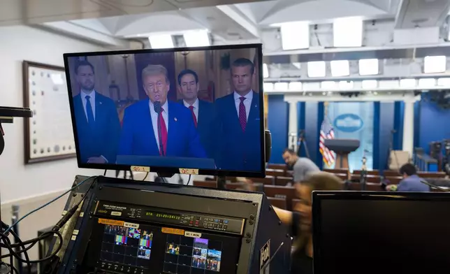 President Donald Trump speaks from the East Room of the White House as seen on a television monitor in the James Brady Press Briefing Room, in Washington, Saturday, June 21, 2025, after the U.S. military struck three sites in Iran. (AP Photo/Alex Brandon)