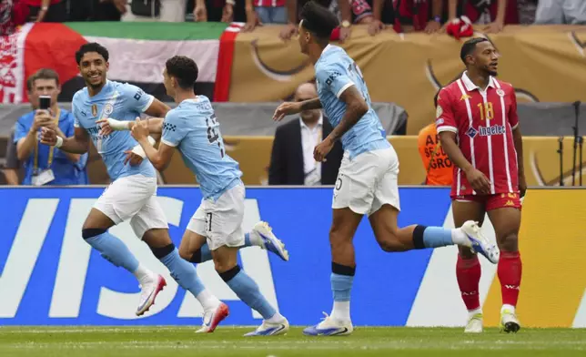 Manchester City players celebrate opening goal by Phil Foden, center, during the Club World Cup group G soccer match between Manchester City and Wydad AC in Philadelphia, Wednesday, June 18, 2025. (AP Photo/Derik Hamilton)