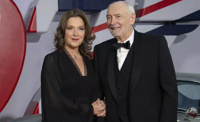 FILE - Producers Barbara Broccoli, left, and Michael G. Wilson appear at the premiere of the film "No Time To Die" in London on Sept. 28, 2021. (Photo by Joel C Ryan/Invision/AP, File)