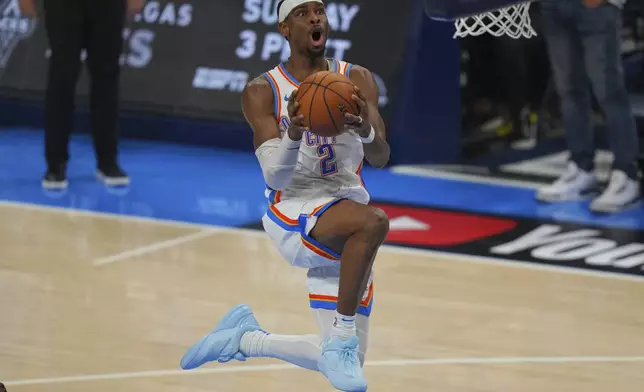 Oklahoma City Thunder guard Shai Gilgeous-Alexander does up to score against the Indiana Pacers during the second half of Game 5 of the NBA Finals basketball series, Monday, June 16, 2025, in Oklahoma City. (AP Photo/Nate Billings)