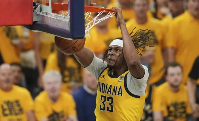 Indiana Pacers center Myles Turner dunks against the Oklahoma City Thunder during the second half of Game 6 of the NBA Finals basketball series, Thursday, June 19, 2025, in Indianapolis. (AP Photo/Michael Conroy)