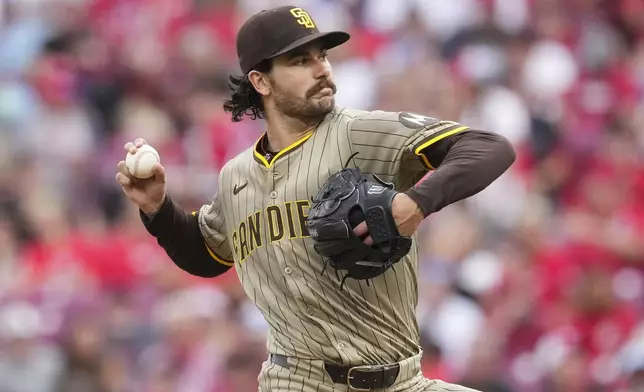 San Diego Padres pitcher Dylan Cease throws during the second inning of a baseball game against the Cincinnati Reds, Friday, June 27, 2025, in Cincinnati. (AP Photo/Jeff Dean)