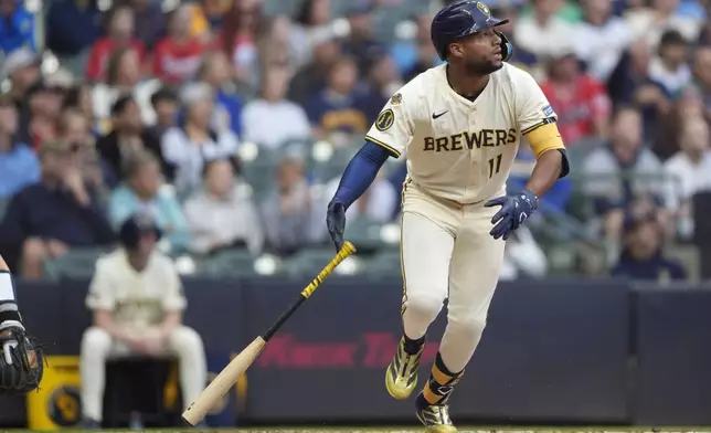 Milwaukee Brewers' Jackson Chourio watches after hitting a two-run home run during the third inning of a baseball game against the Atlanta Braves, Tuesday, June 10, 2025, in Milwaukee. (AP Photo/Aaron Gash)
