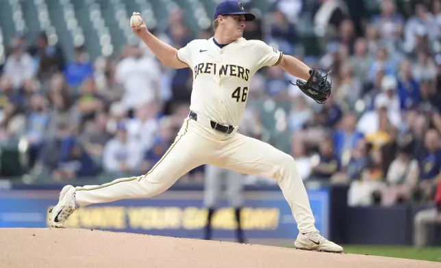 Milwaukee Brewers' Quinn Priester pitches during the first inning of a baseball game against the Atlanta Braves, Tuesday, June 10, 2025, in Milwaukee. (AP Photo/Aaron Gash)