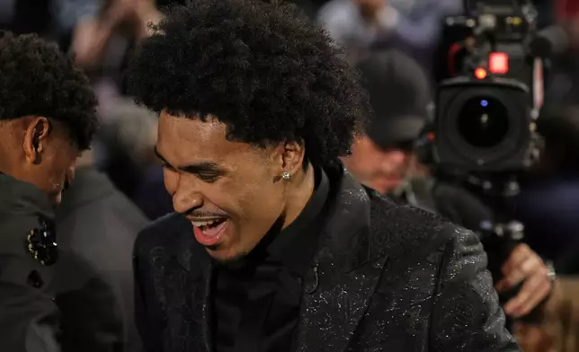 Dylan Harper reacts after being selected second by the San Antonio Spurs In the first round of the NBA basketball draft, Wednesday, June 25, 2025, in New York. (AP Photo/Adam Hunger)