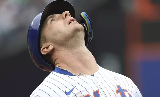 New York Mets' Pete Alonso reacts after Tampa Bay Rays second baseman Brandon Lowe threw the ball to first baseman Jonathan Aranda to put him out during the sixth inning of a baseball game Sunday, June 15, 2025, in New York. (AP Photo/Pamela Smith)