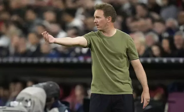Germany's head coach Julian Nagelsmann gestures during the Nations League semifinal soccer match between Portugal and Germany at the Munich Football Arena, in Munich, Germany, Wednesday, June 4, 2025. (AP Photo/Matthias Schrader)