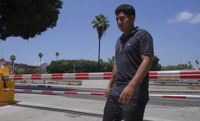Alejandro Barranco arrives at the Metropolitan Detention Center to check on his father Narciso, who was recently detained by federal agents, on Monday, June 23, 2025, in Los Angeles. (AP Photo/Damian Dovarganes)