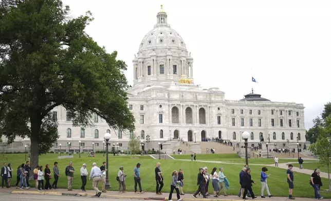 People wait in line to pay their respects to Minnesota state Rep. Melissa Hortman, her husband, Mark Hortman and their dog, Gilbert, at the Minnesota State Capitol in St. Paul, Minn., on Friday, June 27, 2025. (Alex Kormann/Star Tribune via AP)