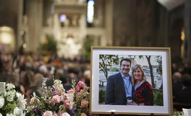 Pictures of Mark and Melissa Hortman are set up inside the sanctuary at the Basilica of St. Mary's during funeral services for Mark and Melissa Hortman in Minneapolis, Minn., on Saturday, June 28, 2025. (Alex Kormann/Star Tribune via AP, Pool)