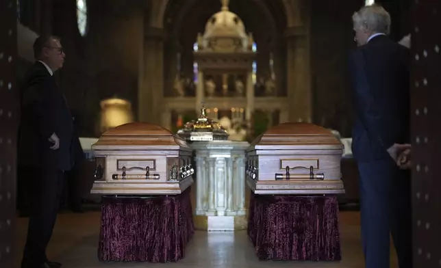 The caskets of Melissa and Mark Hortman sit at the back of the sanctuary before funeral services for Mark and Melissa Hortman at the Basilica of St. Mary in Minneapolis, Minn., on Saturday, June 28, 2025. (Alex Kormann/Star Tribune via AP, Pool)