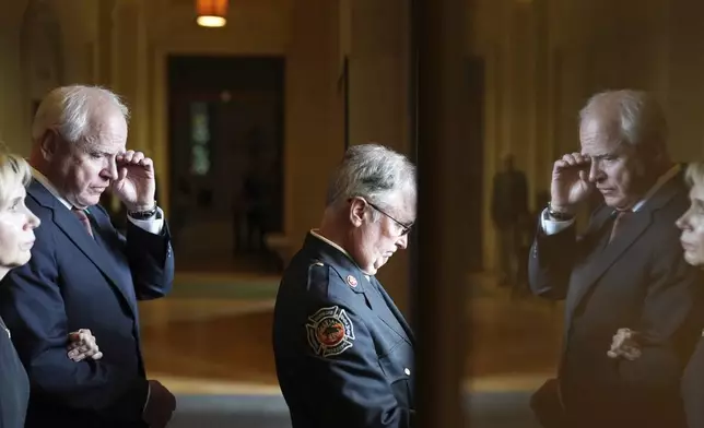 Gwen Walz, left, and Gov. Tim Walz exit the Basilica of St. Mary following funeral services for Mark and Melissa Hortman at the Basilica of St. Mary in Minneapolis, Minn., on Saturday, June 28, 2025. (Alex Kormann/Star Tribune via AP, Pool)