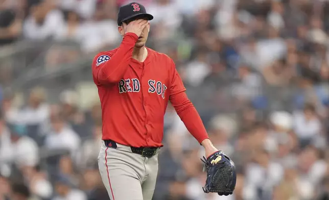 Boston Red Sox pitcher Walker Buehler leaves the field during the first inning of a baseball game against the New York Yankees, Friday, June 6, 2025, in New York. (AP Photo/Frank Franklin II)