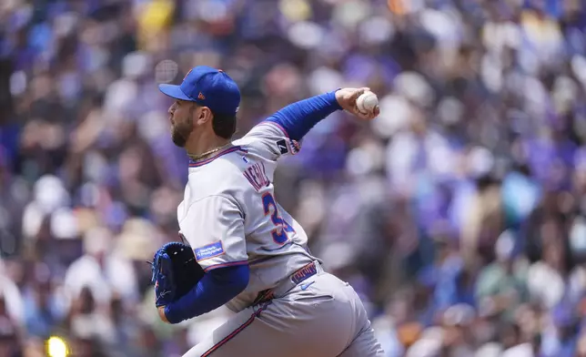 New York Mets starting pitcher Tylor Megill works against the Colorado Rockies in the first inning of a baseball game, Sunday, June 8, 2025, in Denver. (AP Photo/David Zalubowski)