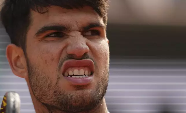 Spain's Carlos Alcaraz reacts as he plays against Italy's Jannik Sinner during their final match of the French Tennis Open at the Roland-Garros stadium in Paris, Sunday, June 8, 2025. (AP Photo/Thibault Camus)