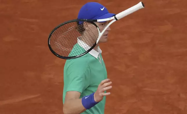 Italy's Jannik Sinner tosses his racket during the final match of the French Tennis Open at the Roland-Garros against Spain's Carlos Alcaraz in Paris, Sunday, June 8, 2025. (AP Photo/Aurelien Morissard)