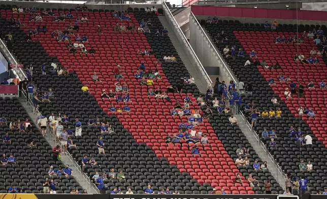 Fans wait for the start of the Club World Cup Group D soccer match between Chelsea and Los Angeles FC, Monday, June 16, 2025, in Atlanta. (AP Photo/Mike Stewart)