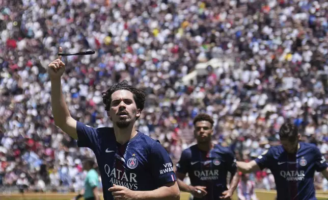 Paris Saint-Germain's Vitinha celebrates scoring his side's second goal during the Club World Cup group B soccer match between PSG and Atletico Madrid in Pasadena, Calif., Sunday, June 15, 2025. (AP Photo/Jae Hong)