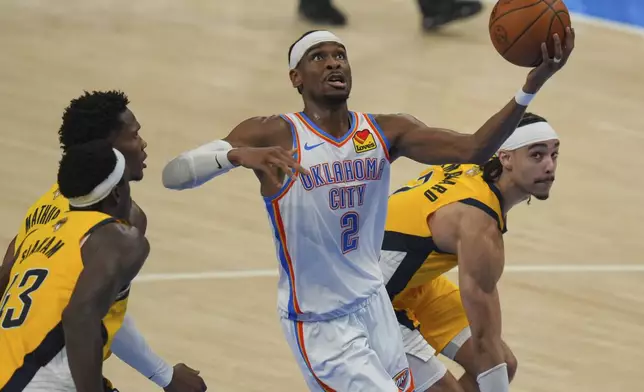 Oklahoma City Thunder guard Shai Gilgeous-Alexander (2) shoots as Indiana Pacers guard Andrew Nembhard, right, defends during the second half of Game 5 of the NBA Finals basketball series, Monday, June 16, 2025, in Oklahoma City. (AP Photo/Nate Billings)