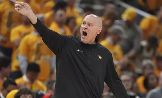 Indiana Pacers head coach Rick Carlisle yells during the first half of Game 4 of the NBA Finals basketball series against the Oklahoma City Thunder, Friday, June 13, 2025, in Indianapolis. (AP Photo/Michael Conroy)