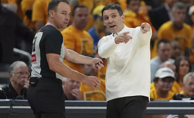 Oklahoma City Thunder head coach Mark Daigneault argues a call with the referee during the second half of Game 4 of the NBA Finals basketball series against the Indiana Pacers, Friday, June 13, 2025, in Indianapolis. (AP Photo/Michael Conroy)