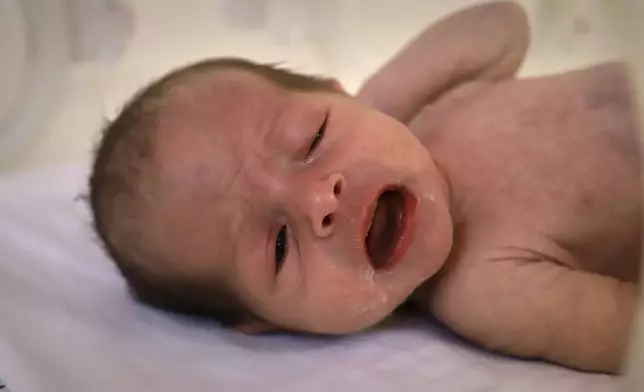 A prematurely born baby lies in an incubator at the neonatal intensive care unit of Nasser Hospital in Khan Younis, southern Gaza Strip, Thursday, June 19, 2025. (AP Photo/Mariam Dagga)