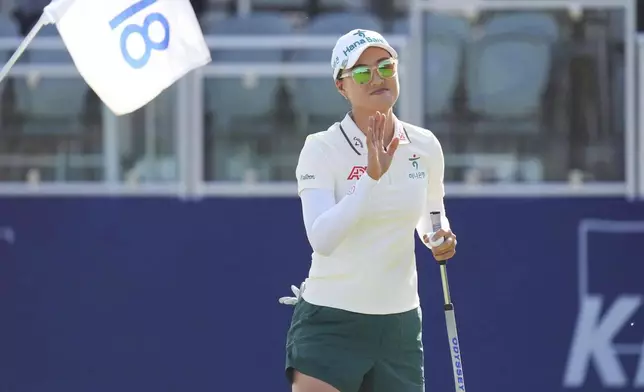 Minjee Lee waves after playing the 18th hole during the third round of the Women's PGA Championship golf tournament Saturday, June 21, 2025, in Frisco, Texas. (AP Photo/LM Otero)