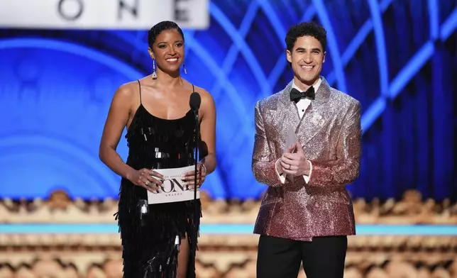 Act One hosts Renee Elise Goldsberry, left, and Darren Criss speak during the 78th Tony Awards on Sunday, June 8, 2025, at Radio City Music Hall in New York. (Photo by Charles Sykes/Invision/AP)