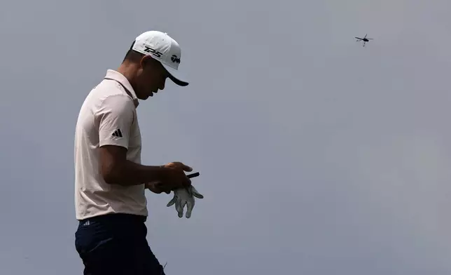 Collin Morikawa walks to the 17th tee during a practice round ahead of the U.S. Open golf tournament at Oakmont Country Club Tuesday, June 10, 2025, in Oakmont, Pa. (AP Photo/Charlie Riedel)