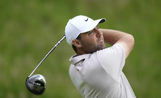 Scottie Scheffler tees off on the seventh hole during a practice round ahead of the U.S. Open golf tournament at Oakmont Country Club Tuesday, June 10, 2025, in Oakmont, Pa. (AP Photo/Seth Wenig)