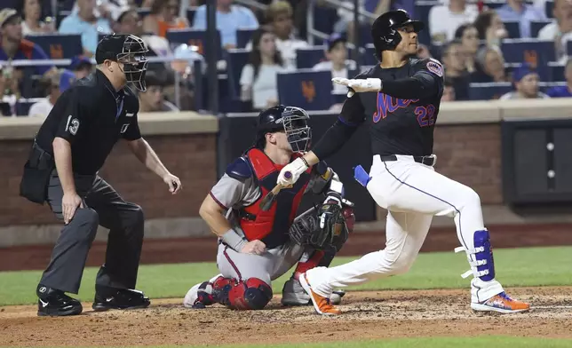 New York Mets' Juan Soto hits a home run during the sixth inning of a baseball game leading Brandon Nimmo to score against the Atlanta Braves Monday, June 23, 2025, in New York. (AP Photo/Pamela Smith)