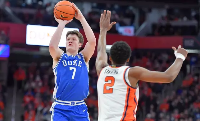 FILE - Duke guard/forward Kon Knueppel (7) shoots over Syracuse guard J.J. Starling (2) during the first half of an NCAA college basketball game in Syracuse, N.Y., Wednesday, Feb. 5, 2025. (AP Photo/Adrian Kraus, File)