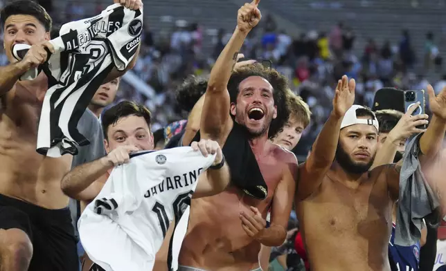 Fans celebrate after Botafogo won the Club World Cup group B soccer match between PSG and Botafogo in Pasadena, Calif., Thursday, June 19, 2025. (AP Photo/Jae C. Hong)