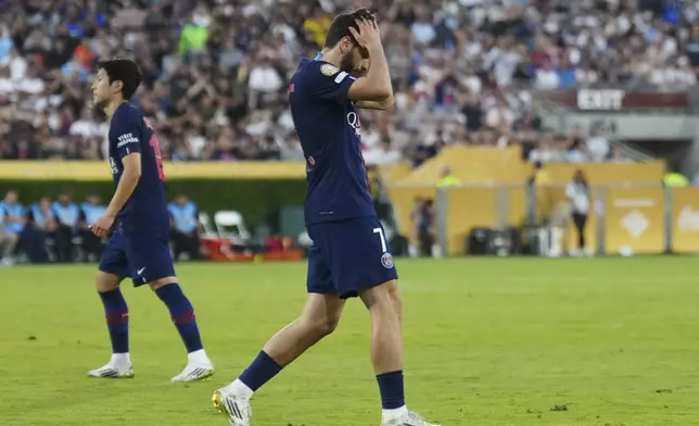 Paris Saint-Germain's Khvicha Kvaratskhelia reacts after his free kick went above the goal during the Club World Cup group B soccer match between PSG and Botafogo in Pasadena, Calif., Thursday, June 19, 2025. (AP Photo/Jae C. Hong)