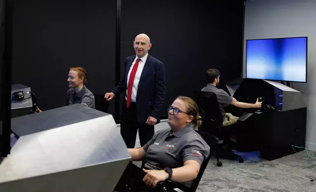 Britain's Defence Secretary John Healey is shown an air to air combat simulation during a visit to the MBDA Storm Shadow factory in Stevenage, England, Saturday May 31, 2025. (Dan Kitwood/Pool via AP)