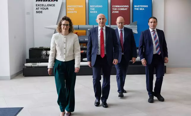 Britain's Defence Secretary John Healey, second left, visits the MBDA Storm Shadow factory in Stevenage, England, Saturday May 31, 2025. (Dan Kitwood/Pool via AP)