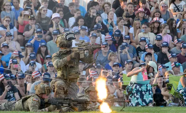 U.S. Army soldiers hold a demonstration for the crowd during the Army Birthday Twilight Tattoo event at Joint Base Myer-Henderson Hall, Wednesday, June 11, 2025, in Fort Myer, Va. (AP Photo/Rod Lamkey, Jr.)