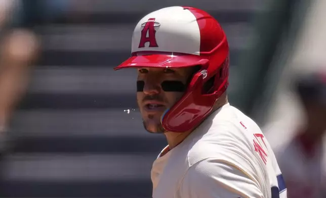 Los Angeles Angels' Mike Trout spits during his at-bat in the first inning of a baseball game against the Seattle Mariners, Sunday, June 8, 2025, in Anaheim, Calif. (AP Photo/Mark J. Terrill)