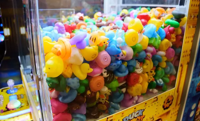 Rubber ducks in a claw machine at Playland's Castaway Cove amusement park, in Ocean City, N.J, on Friday, June 6, 2025. (AP Photo/Mingson Lau)