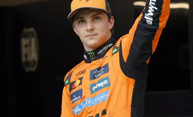 McLaren driver Oscar Piastri of Australia celebrates his pole position after the qualifying session ahead of the Spanish Grand Prix Formula One race at the Barcelona Catalunya racetrack in Montmelo, near Barcelona, Spain, Saturday, May 31, 2025. (AP Photo/Joan Monfort)